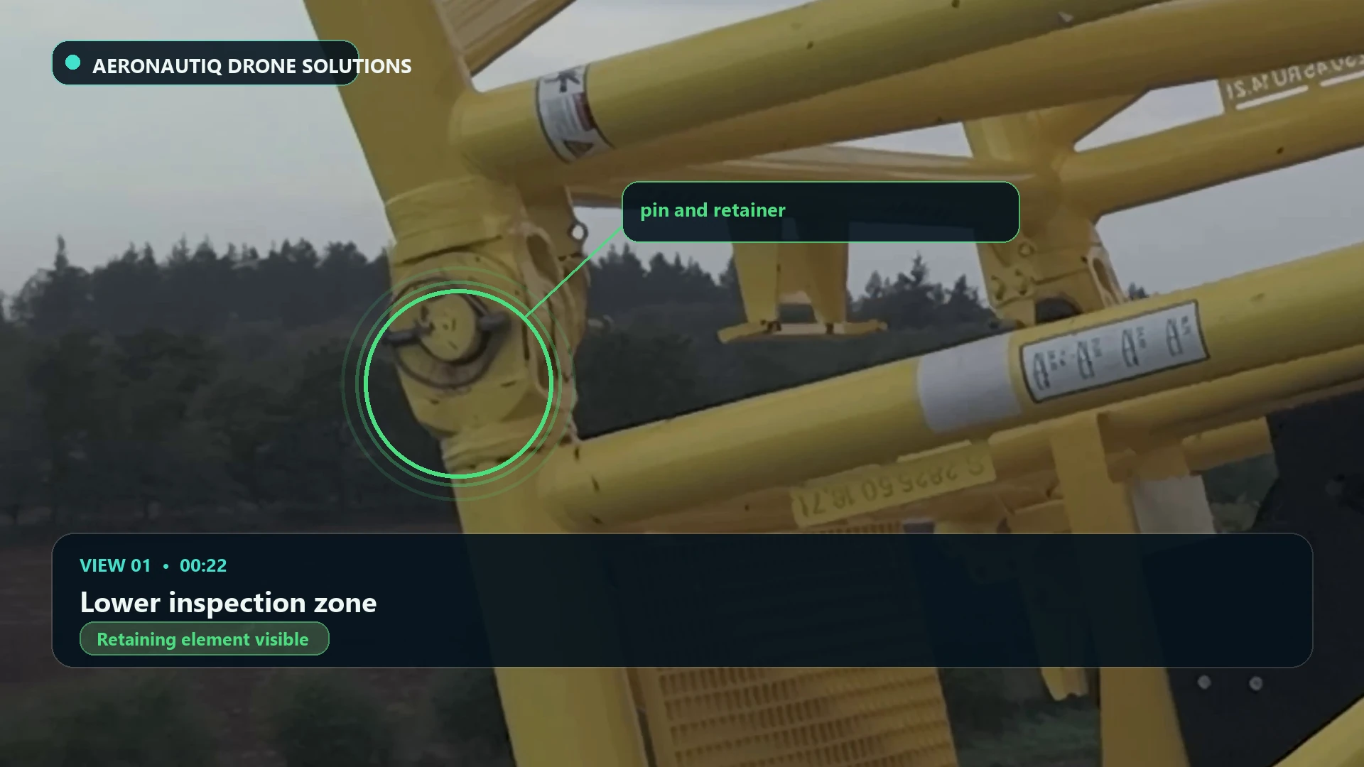 Highlighted retainer on a left-hand crane boom pin